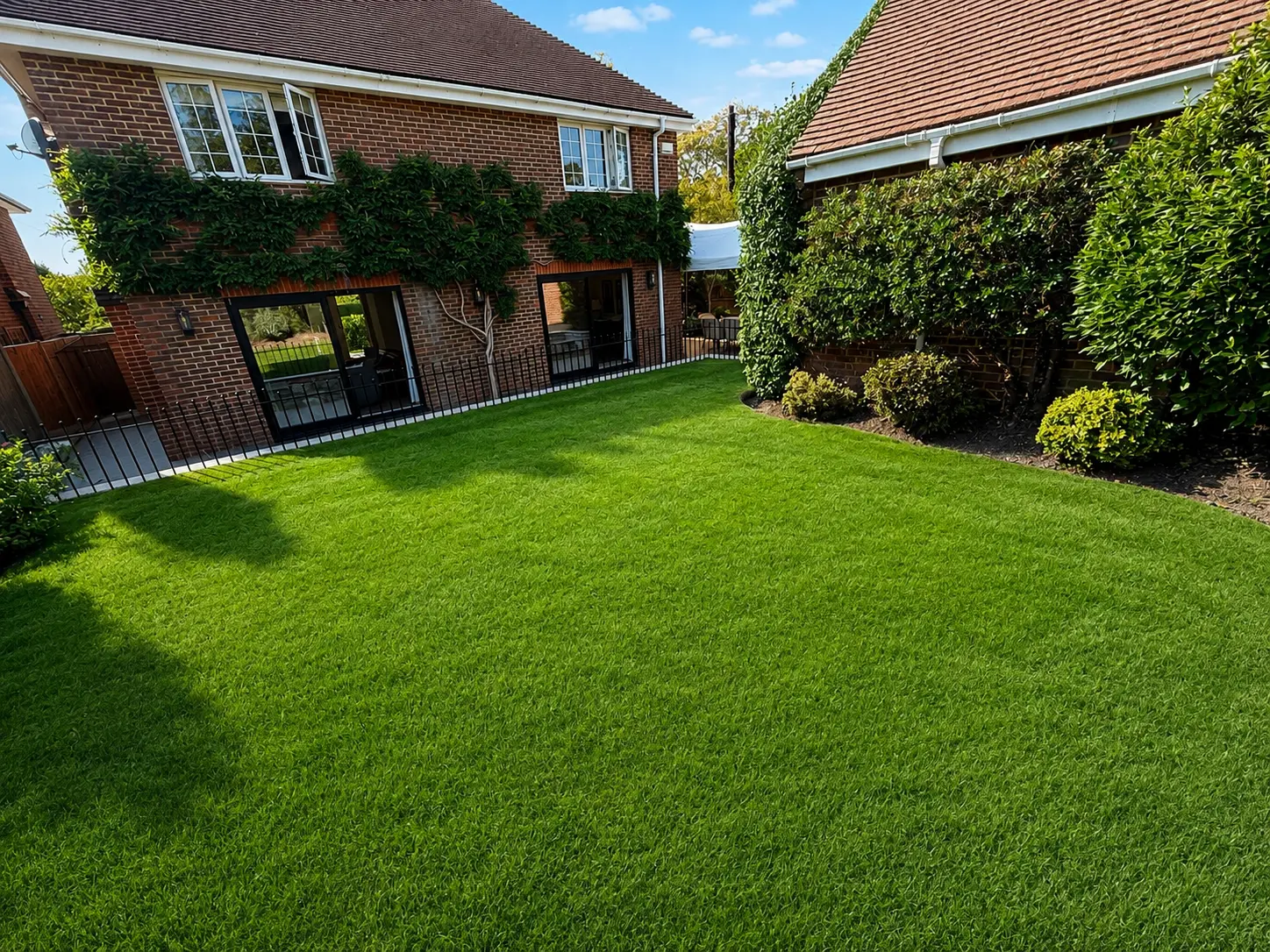 Level rear lawn with sliding doors back into the house